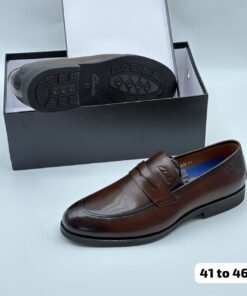 Brown leather Clarks penny loafers.